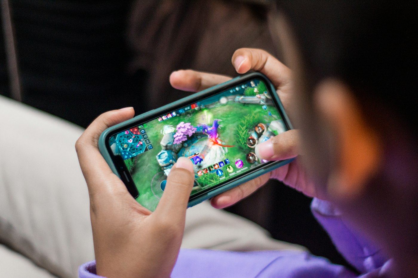 A player in a game on their phone